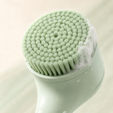 Close-up of the Luma Lather Reach soft bristle head with light lather
