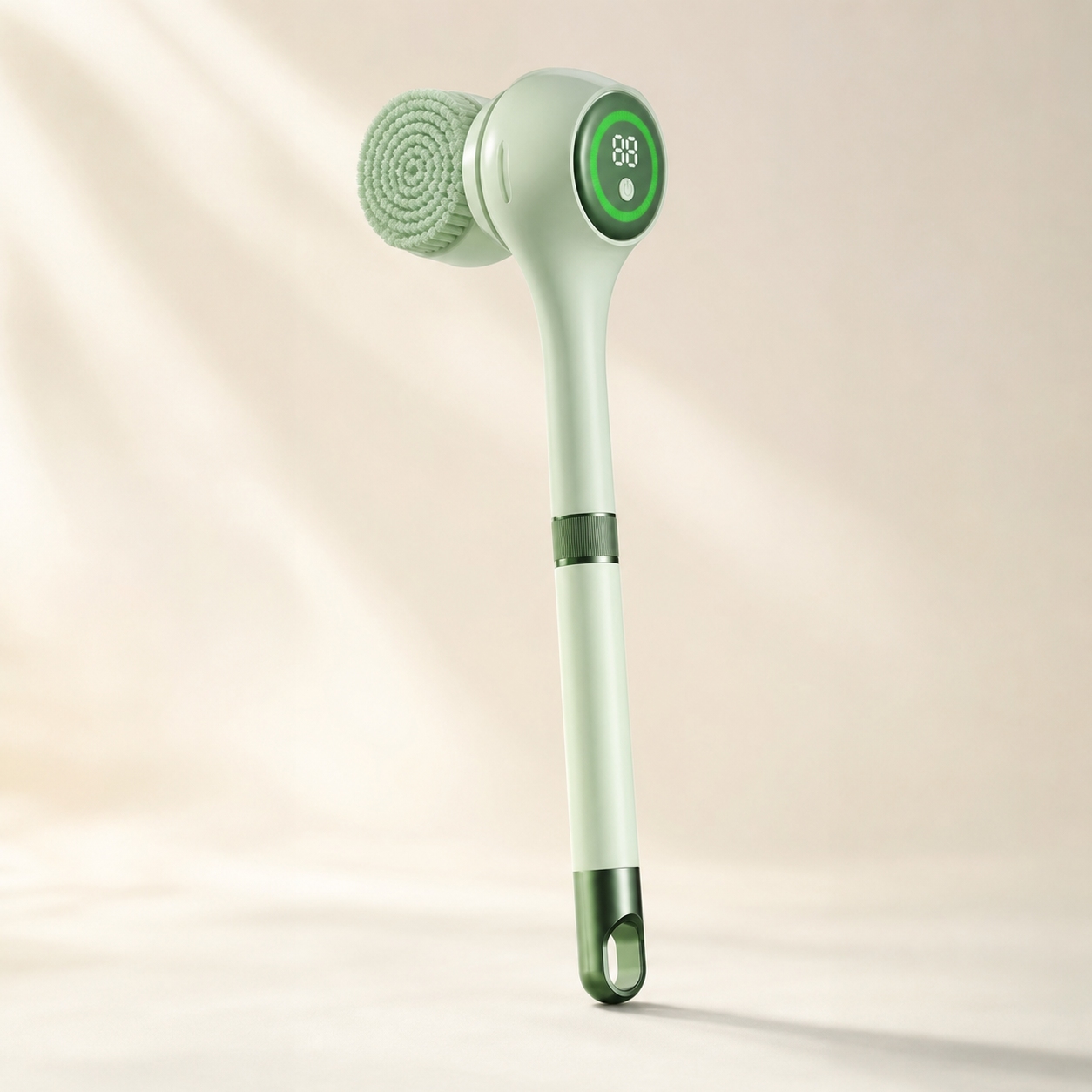 Luma Lather Reach mint electric bath brush on a warm ivory background